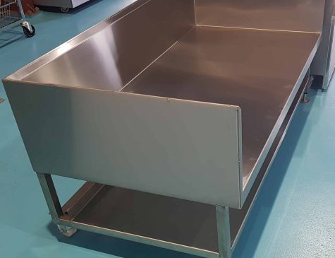 Stainless steel cooking bench side view